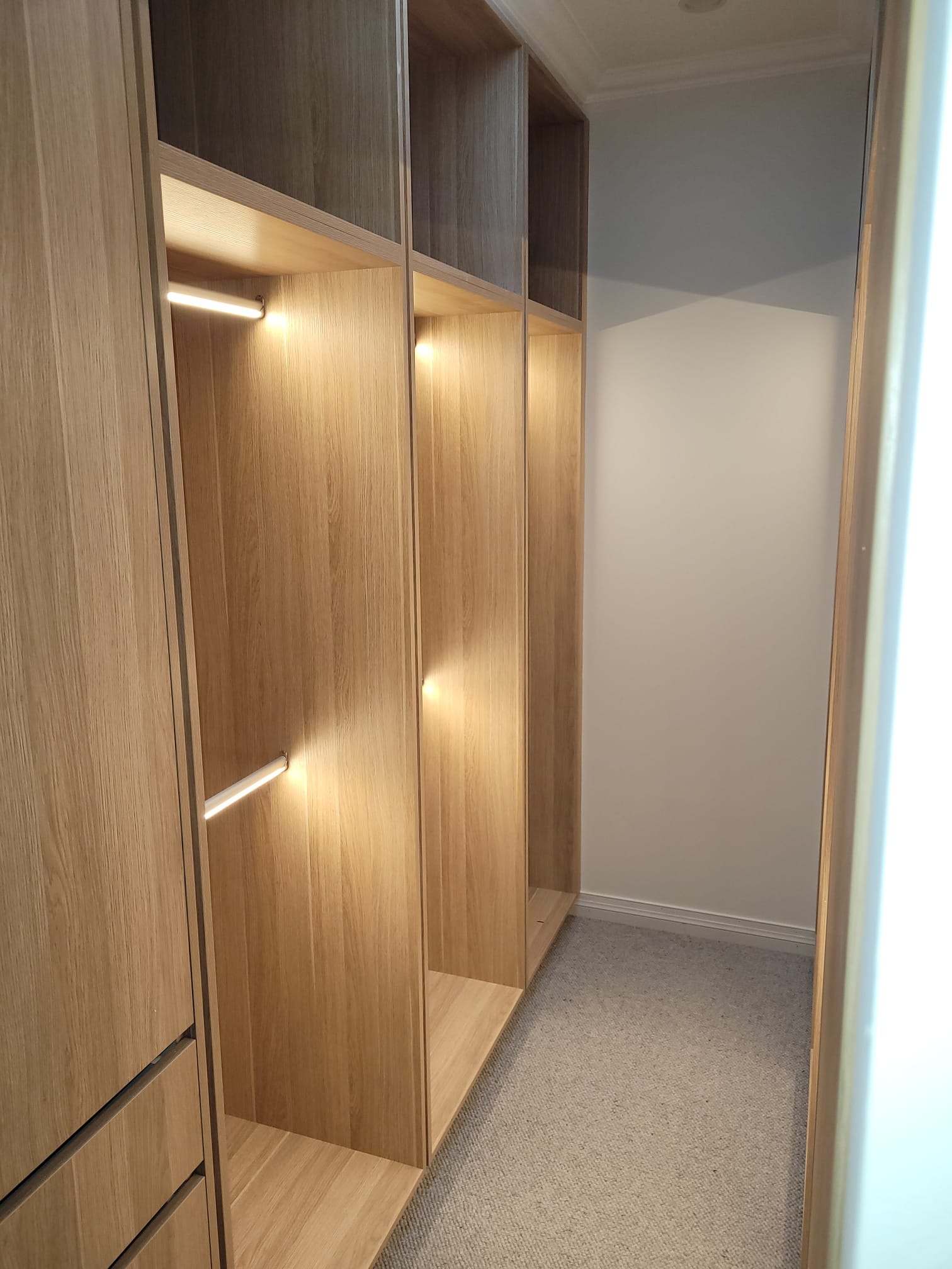 Walk-in wardrobe with integrated LED strip lighting