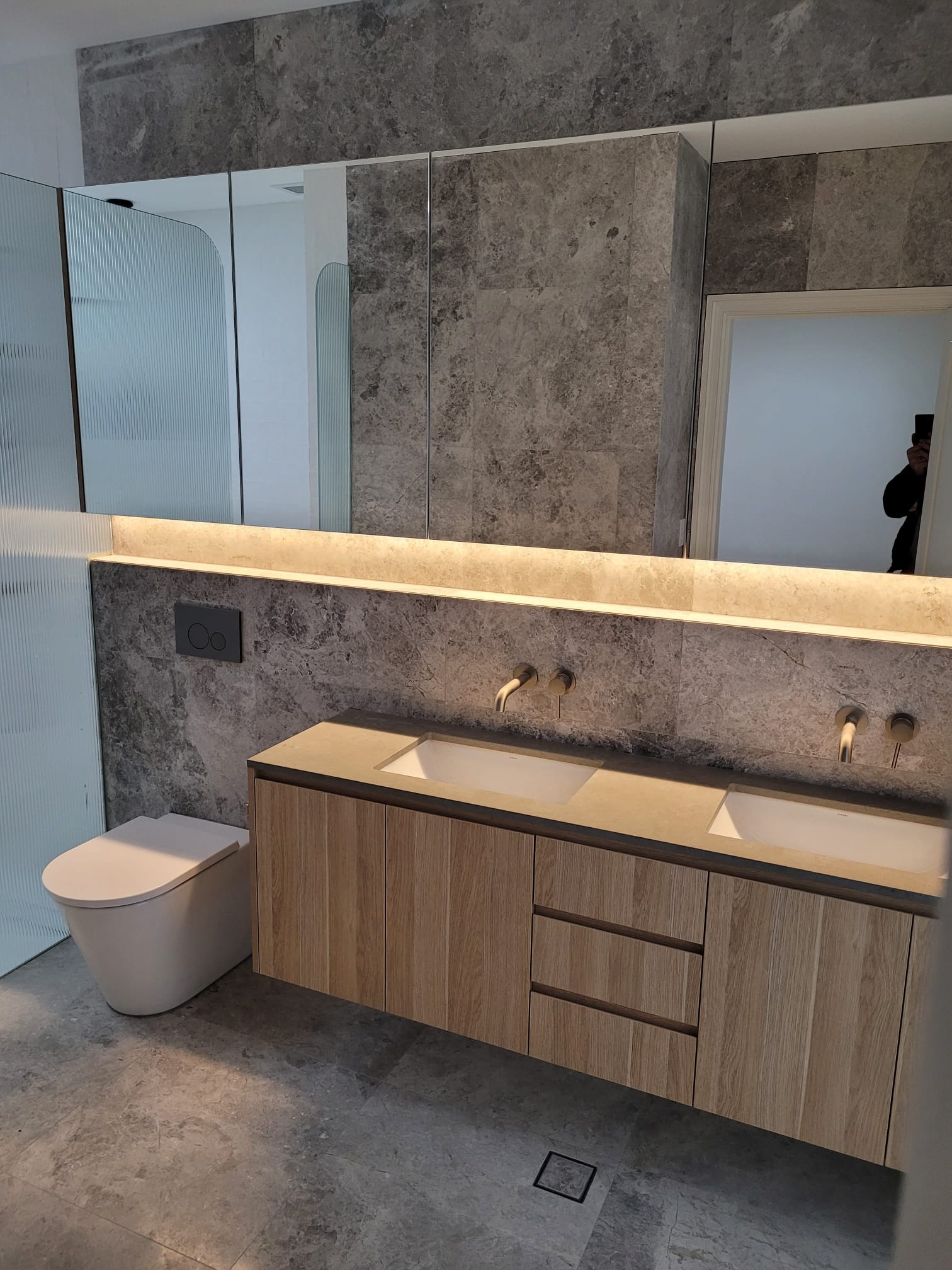 Modern bathroom with concealed LED feature lighting strip